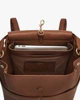 Open backpack with laptop and accessories inside.