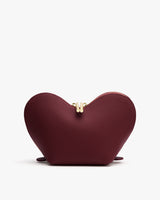 Heart-shaped pouch with a central zipper on a white background