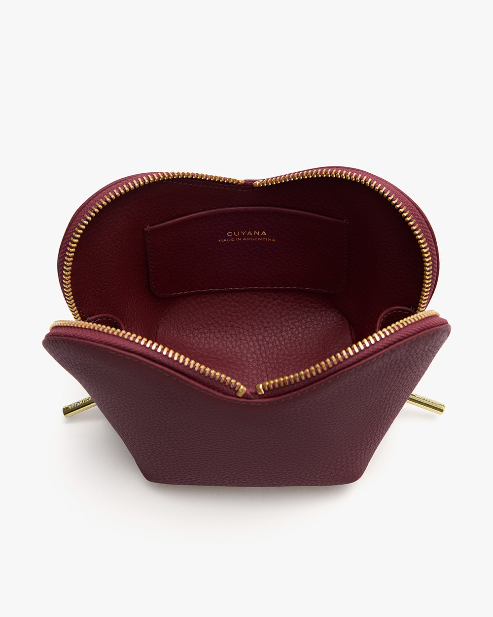Open leather pouch with zipper detailing and brand label inside