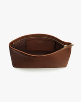 Leather zippered pouch with open interior and small inner pocket.