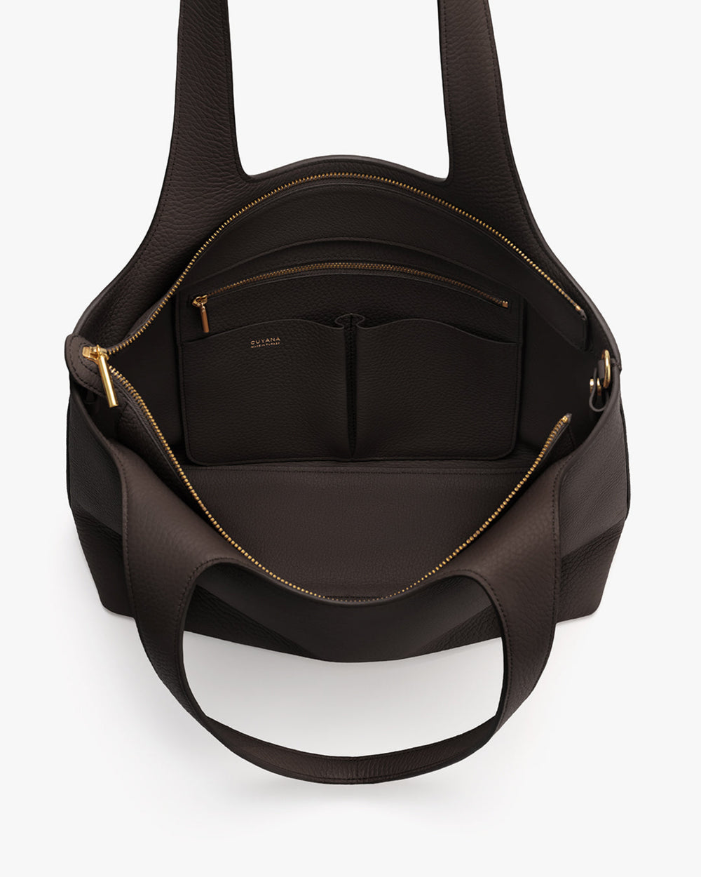 Open tote bag with pockets and zippers visible inside.