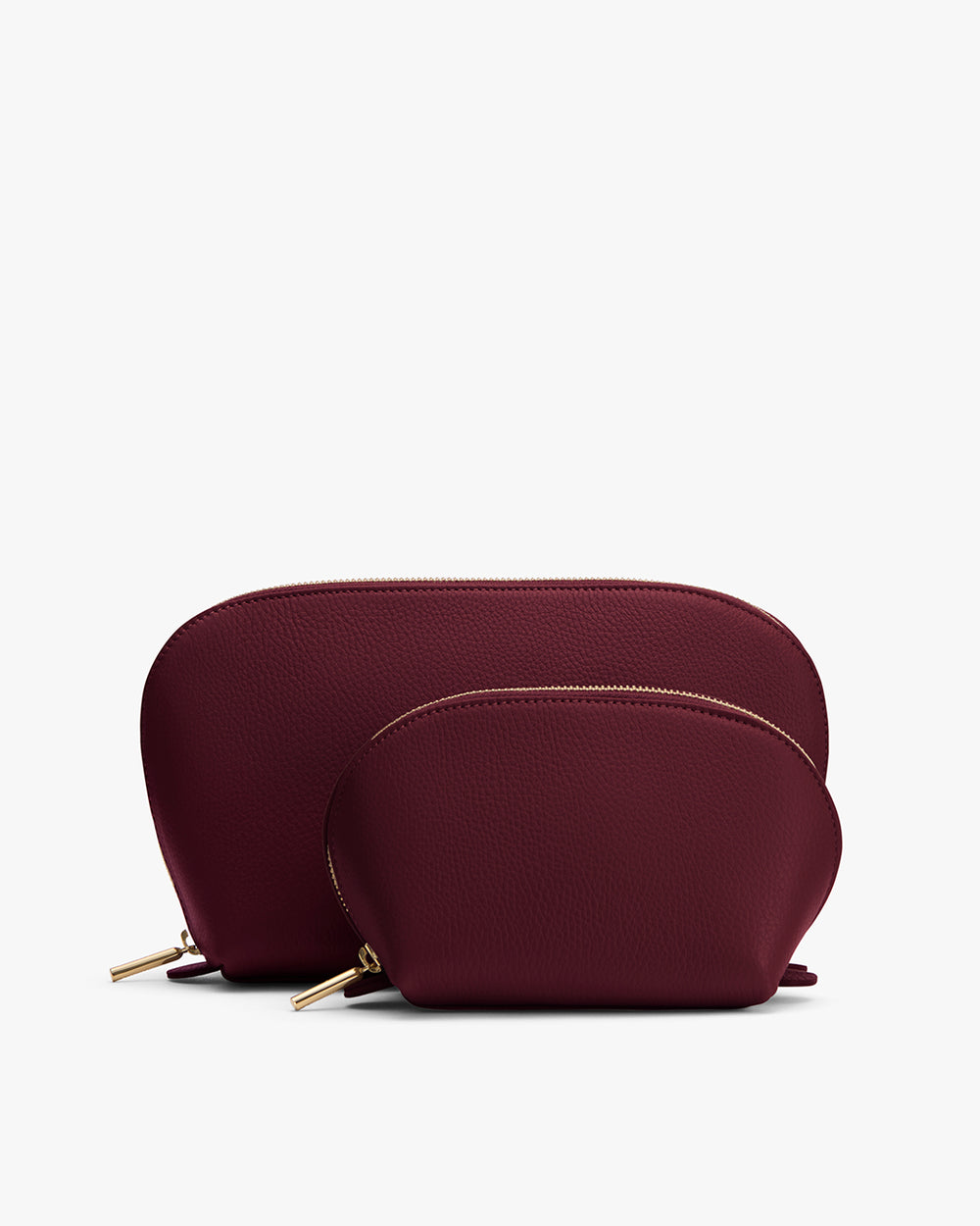 Two semi-circular pouches with zip closures placed side by side.