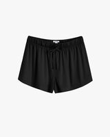 Elastic waist shorts with drawstring on plain background