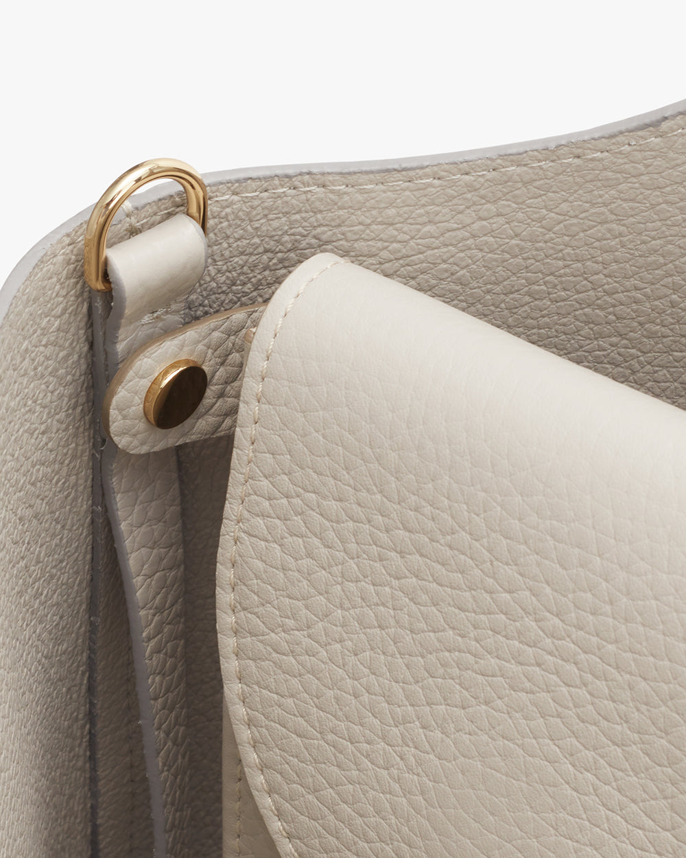 Close-up of a handbag showing its texture and metal hardware details.