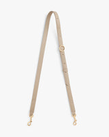 Adjustable strap with buckle and clasps at ends.