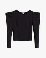Long-sleeve top with shoulder pads displayed against a plain background.
