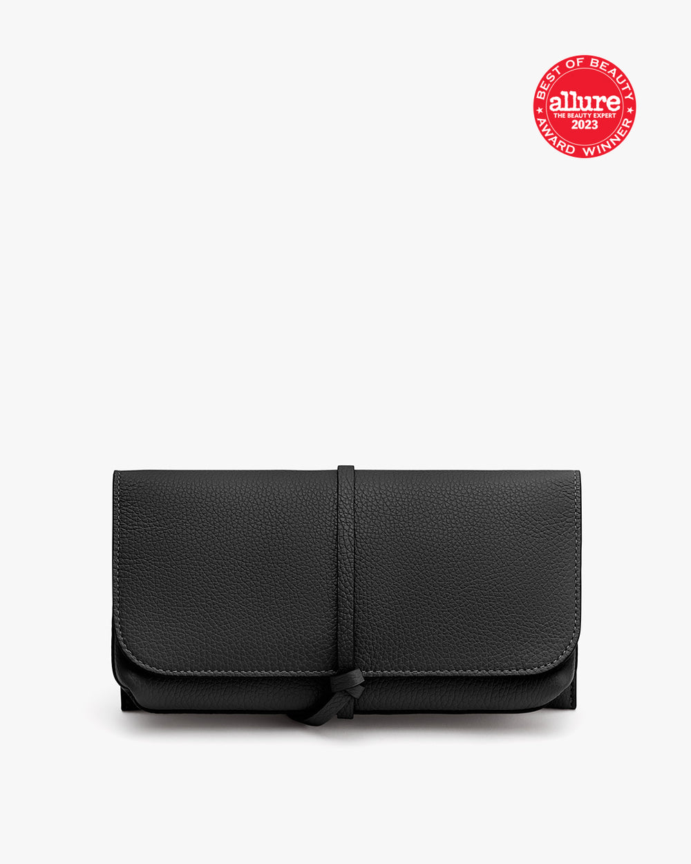 A folded wallet with a strap and a seal in the top right corner.