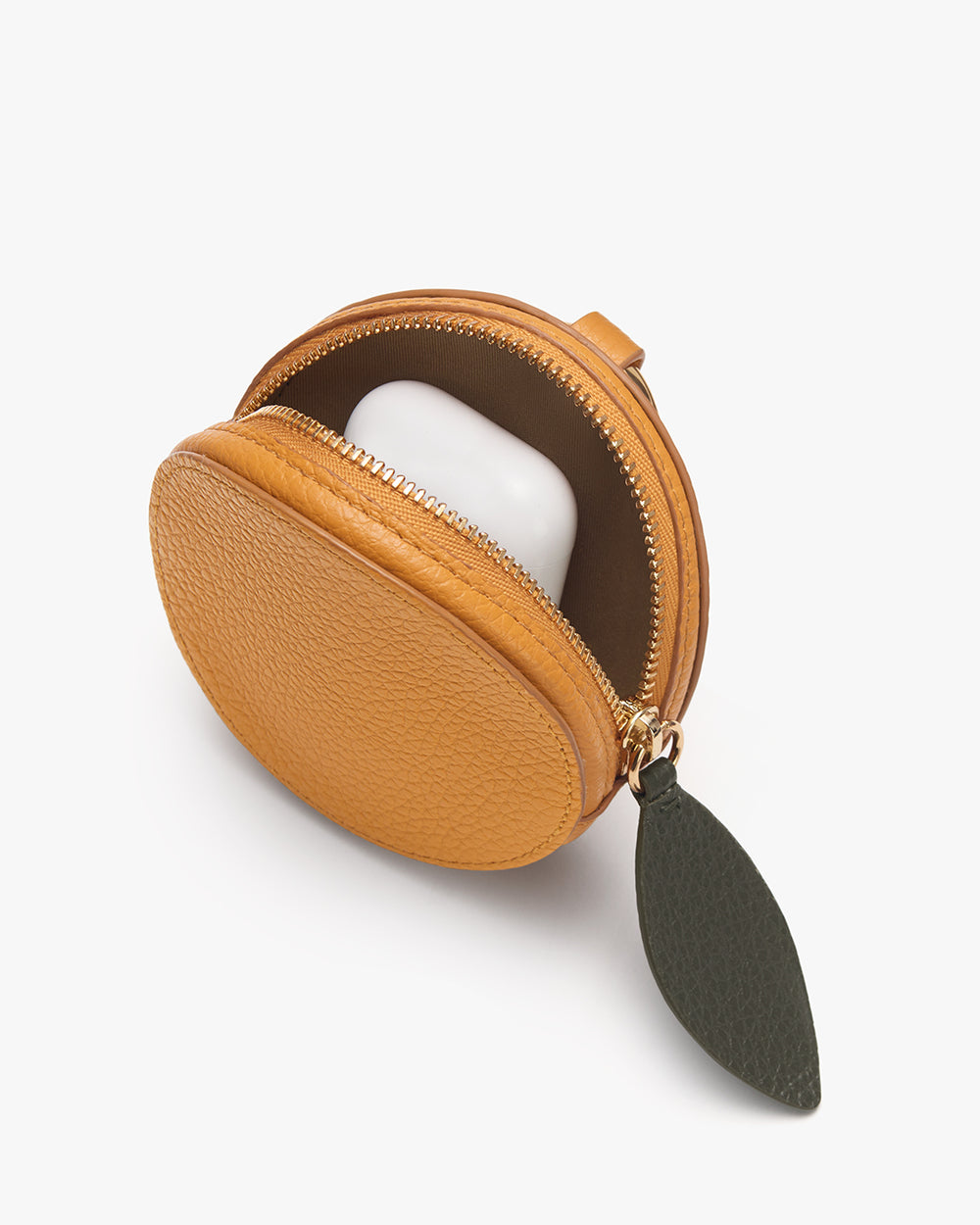 Round pouch with zipper and leaf-shaped keychain attachment.