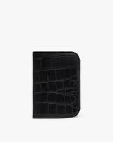 Wallet with textured exterior standing against a plain background.