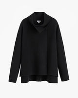 Collared sweater displayed against a plain background.