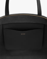 Open tote bag with a visible inner pocket and zipper closure.