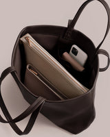 Open handbag with two pouches and a smartphone inside