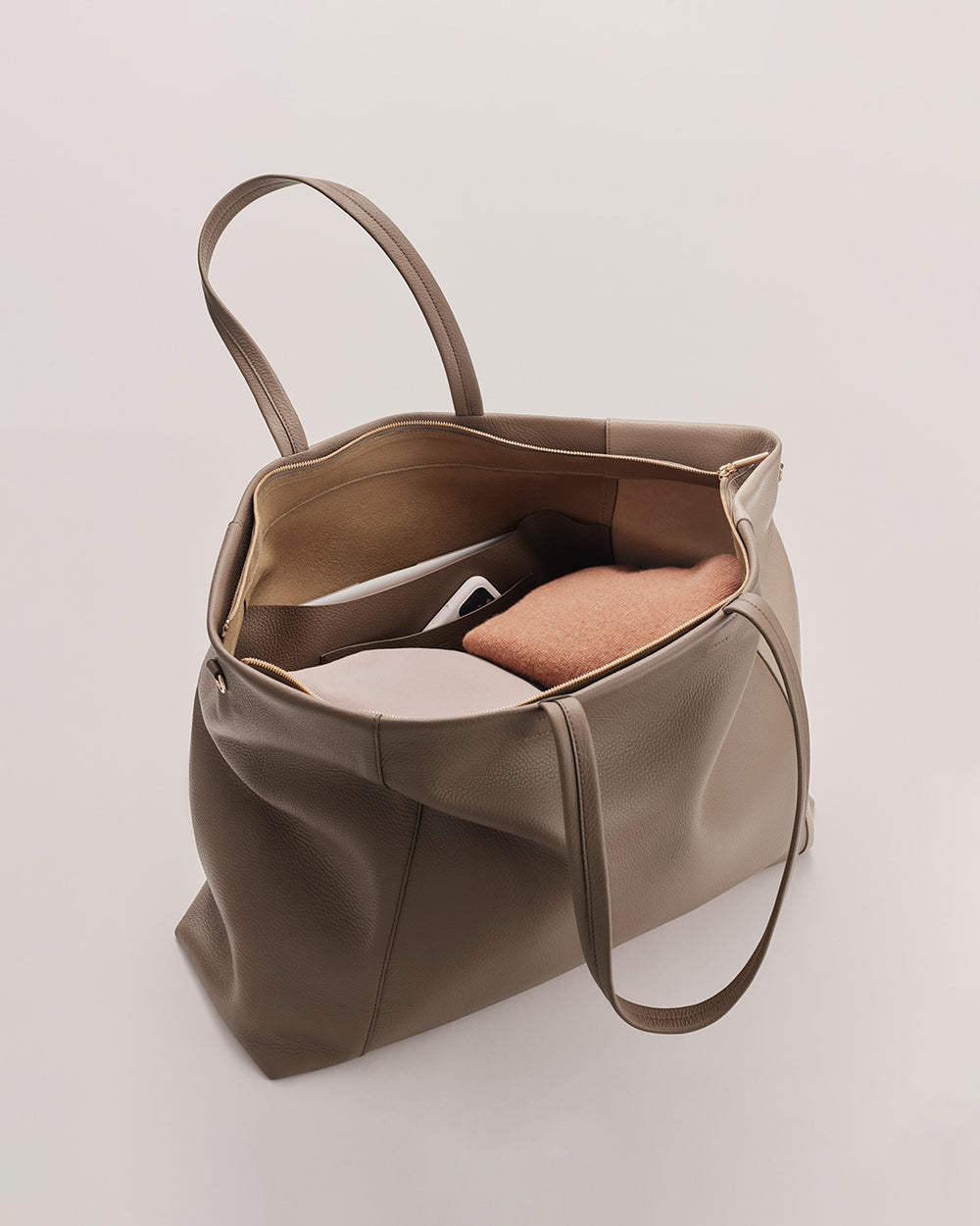 Open tote bag with a book inside.