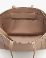 Open handbag showing interior pockets and design details.