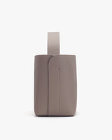 Rectangular bag with a vertical handle on a plain background.