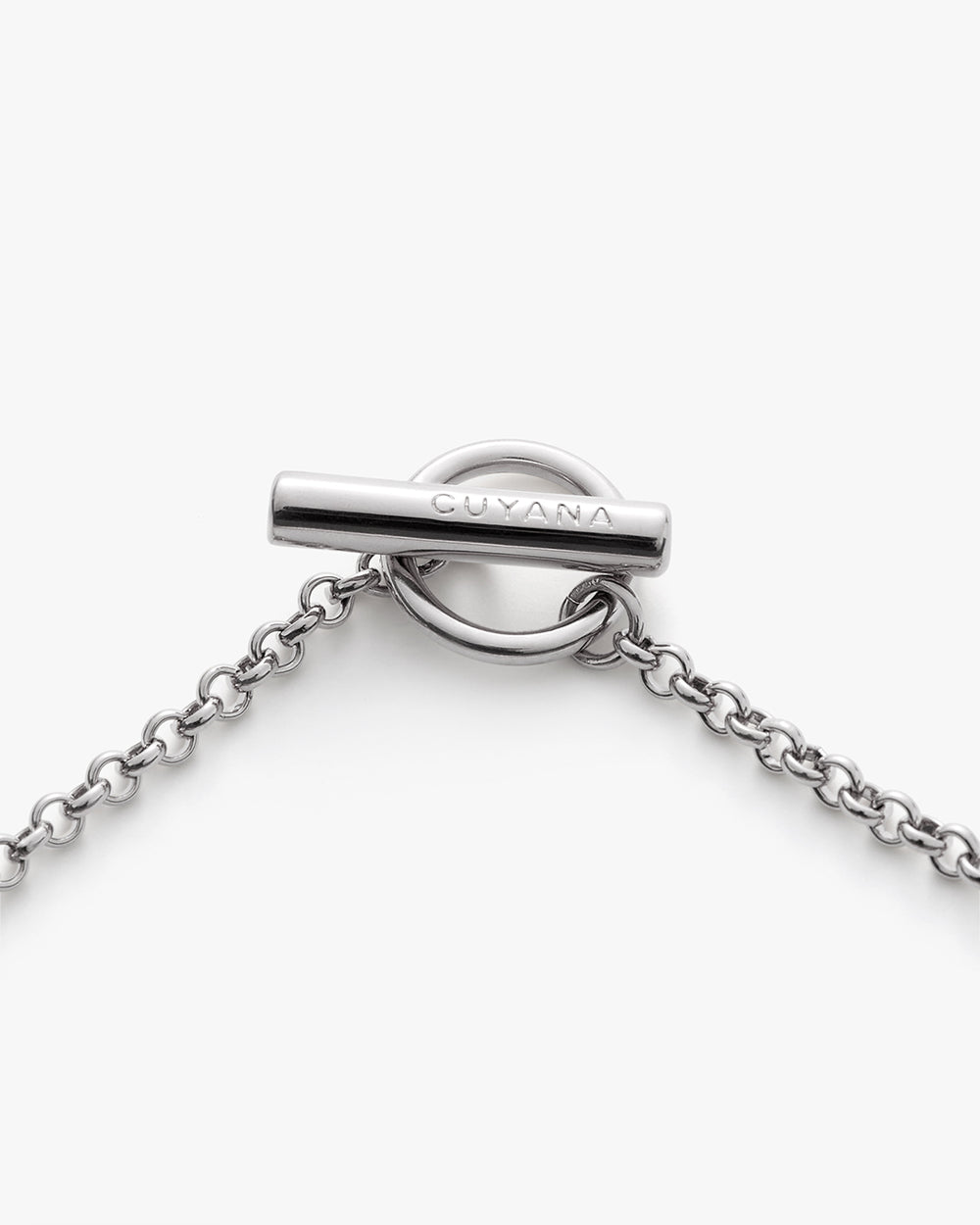 Metal chain with a circular clasp and brand name inscribed.