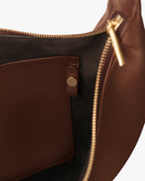 Open bag with visible pocket and zipper pull.