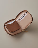 Wallet with a zippered pocket open, showing a card inside.