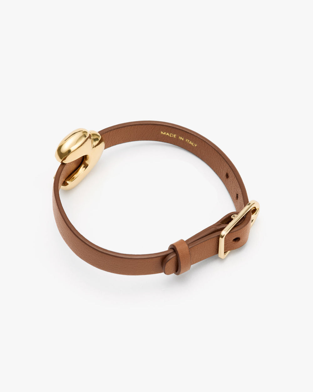 Leather bracelet with a round metal accent and adjustable buckle.