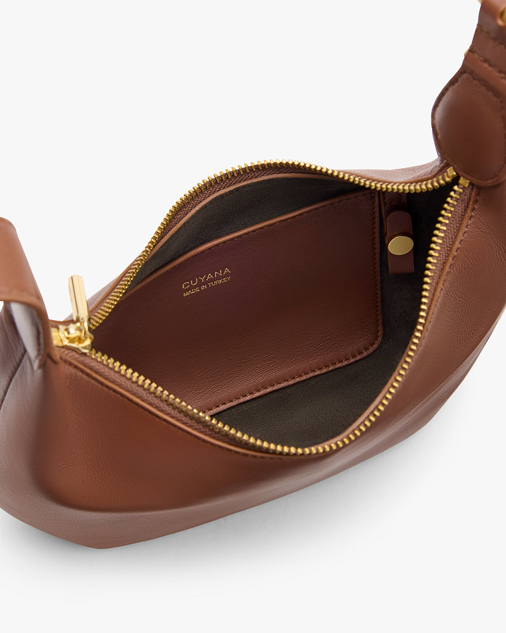 Open handbag with visible interior pocket and zipper.