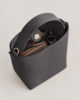 Open handbag with inner compartments and a snap button closure