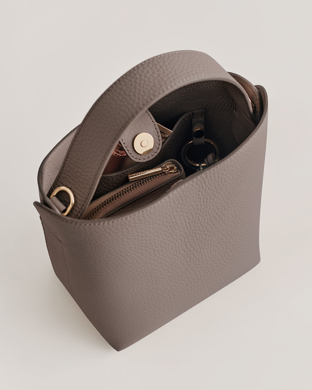 Open handbag with wallet and small pouch inside