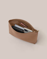 Open pouch with wallet, phone, and cosmetic items inside
