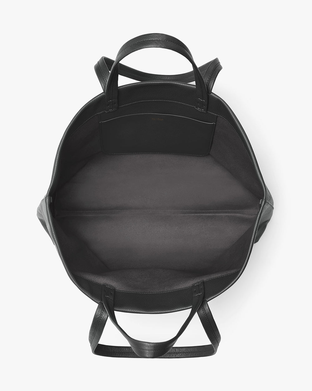 Top view of an open empty backpack with handles