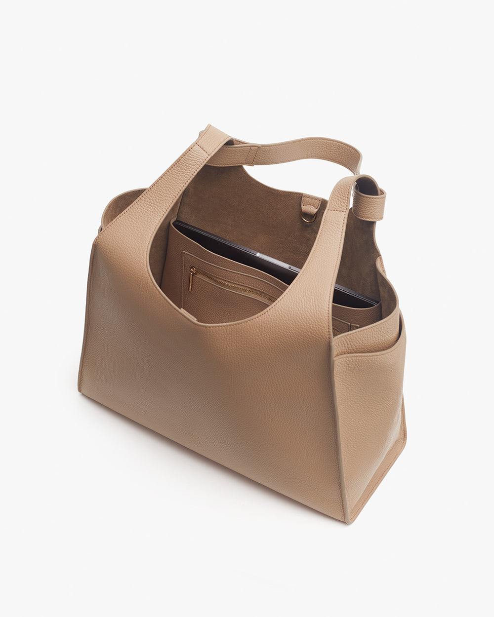 Handbag with open top and internal pockets, isolated on a white background.