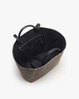 Open tote bag with interior pocket and attached handle straps.