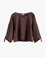 Loose-fitting, three quarter sleeve blouse with wide neckline.