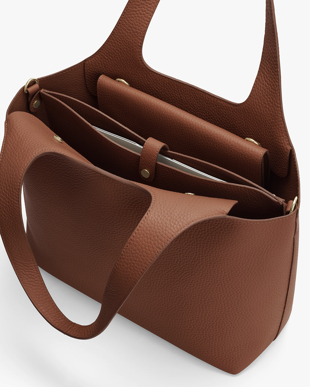 Open handbag with multiple compartments and a strap
