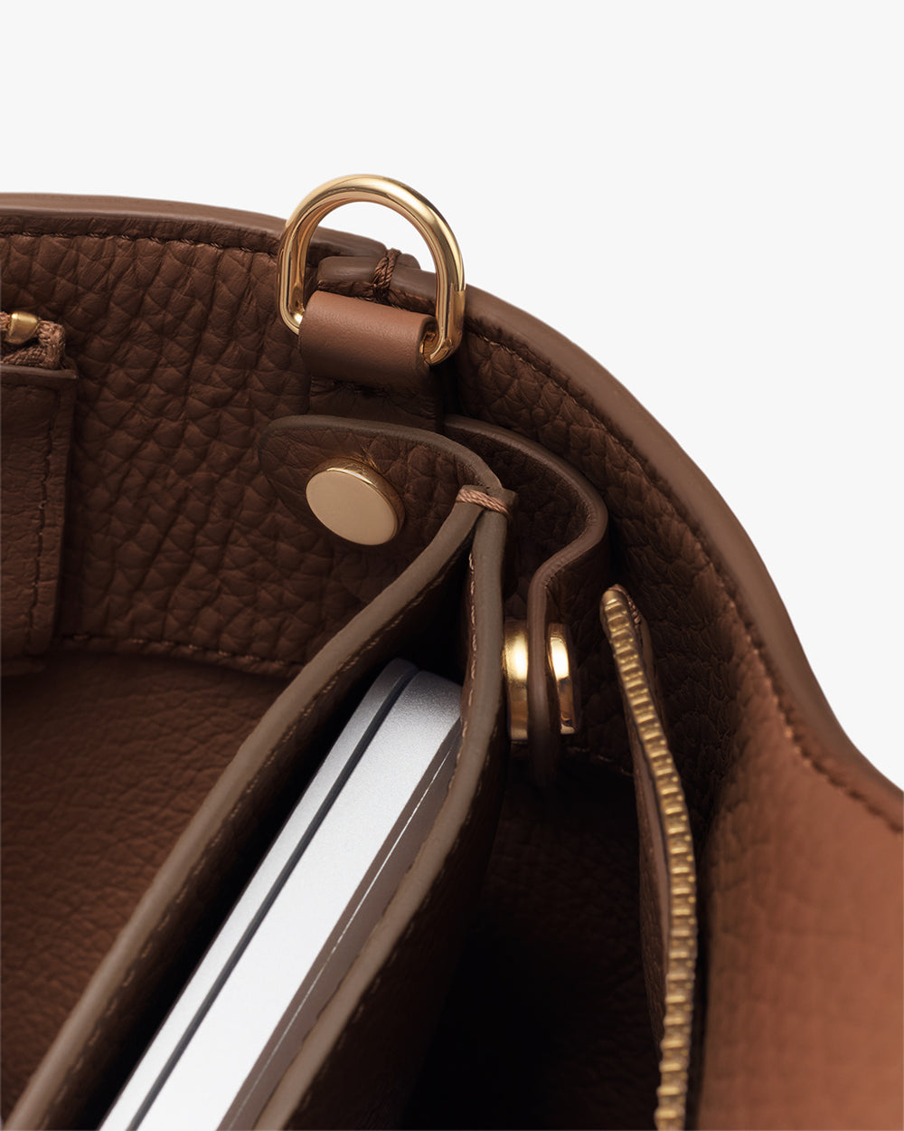 Open bag with a visible laptop inside and zipper detail.
