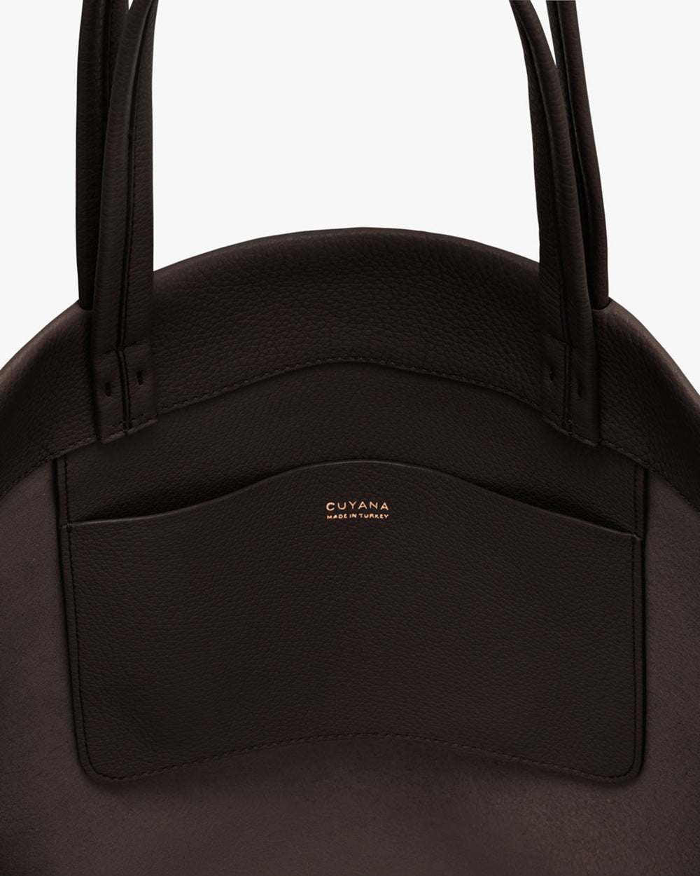 Close-up of a bag with dual handles and a small interor pocket