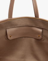 Open travel bag with zipper and handle visible