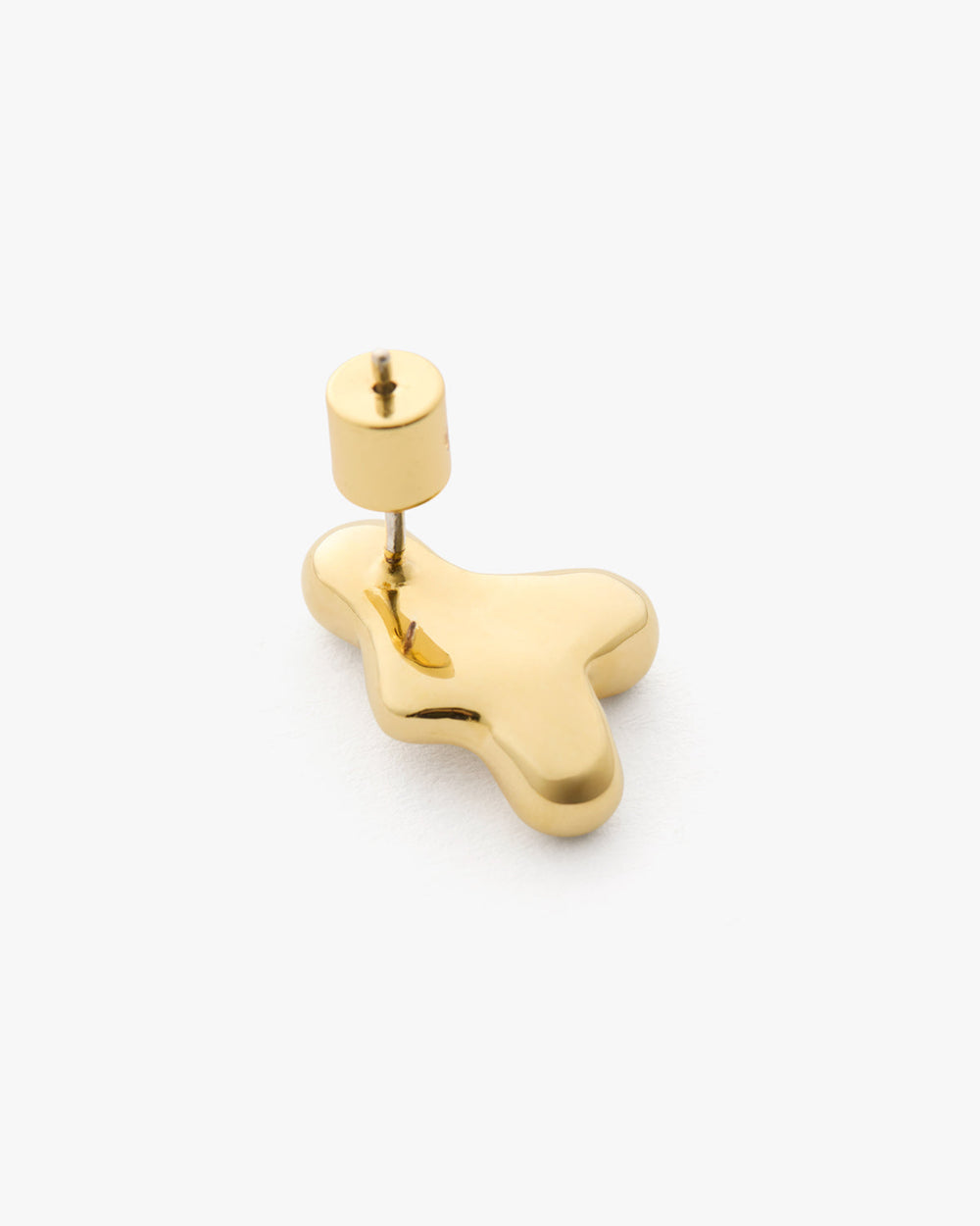 Abstract-shaped gold earring with a stud post.