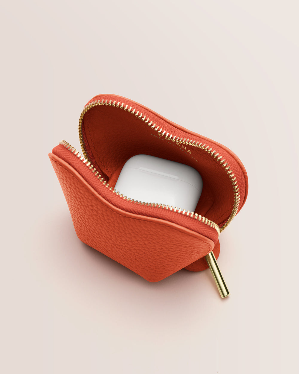 Small zippered pouch with white earbuds inside.