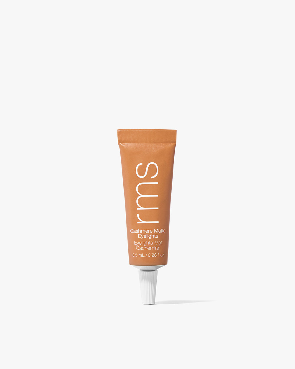 Small tube of cream eyeshadow with text on it.