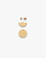 Set of three geometric earrings laid out flat.