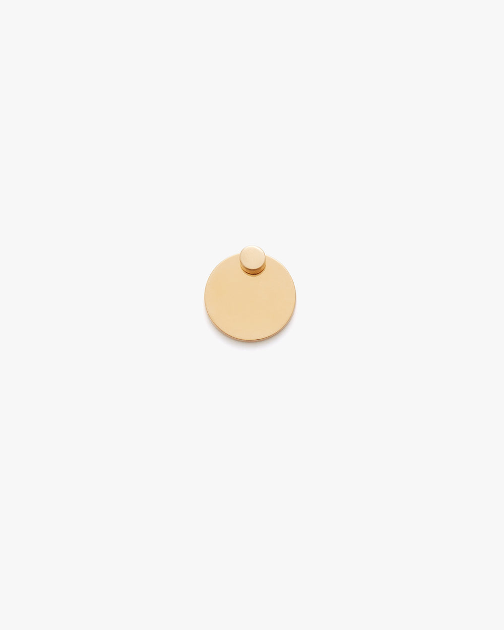 Round flat disc with a smaller circle on top.