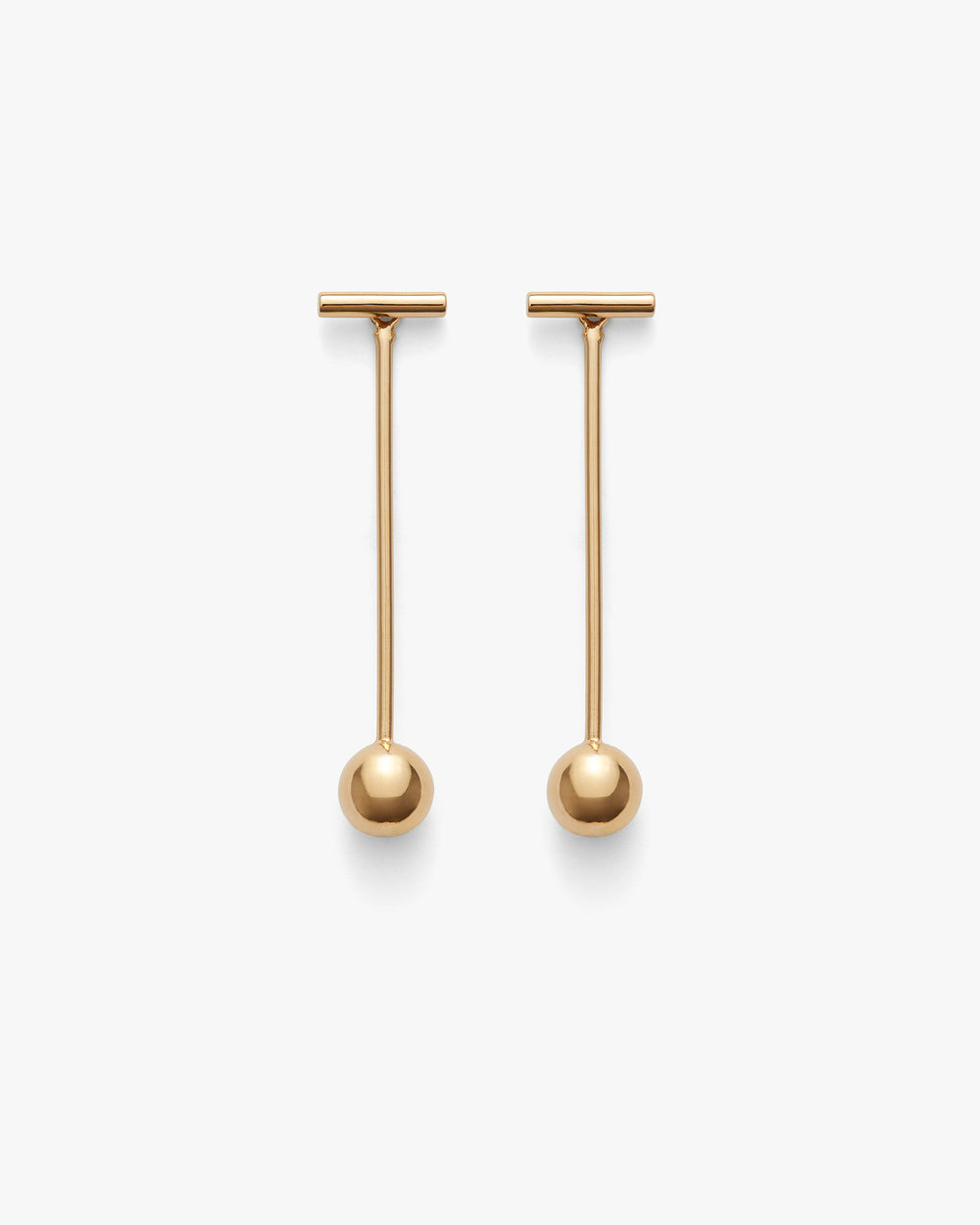 Two long drop earrings with round ends on a plain background.