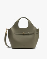 Handbag with a detachable strap and front buckle detail.