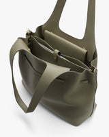 Handbag with shoulder straps and open compartments.
