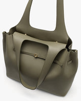Tote bag with dual handles and front pocket, metal button closure.