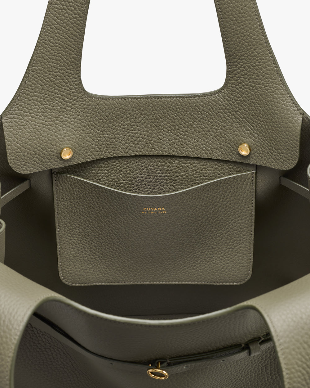 Open handbag interior with inner pocket and brand logo.