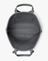 Open travel bag with handles and visible inner pocket