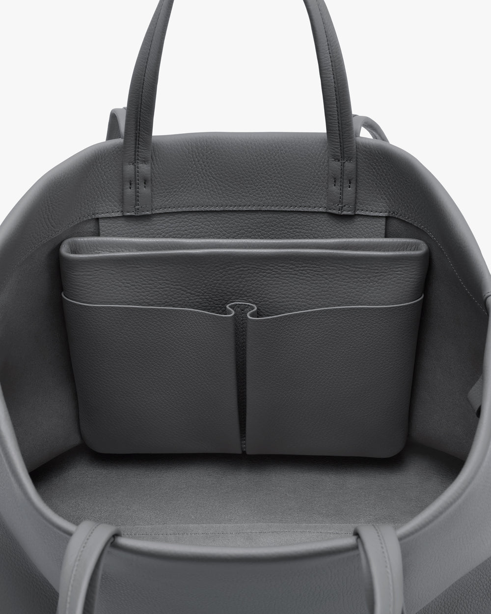 Open travel bag with interior pocket.