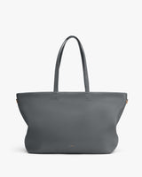 Tote bag with long handles and minimal design.