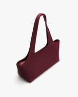 Simple tote bag with an open top and wide strap.