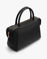 Elegant handbag with zipper and short handles.